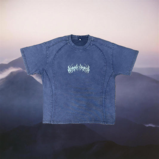 Acid wash indigo tee with neo tribal chest print, dusk mountain backdrop