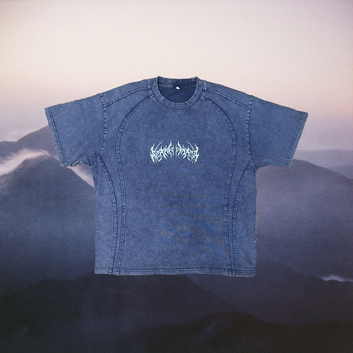 Acid wash indigo tee with neo tribal chest print, dusk mountain backdrop